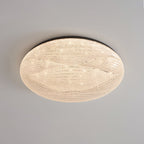 Black-rimmed Clérachic ceiling light with a clear, crystal-textured shade, seen from below on a grey ceiling.