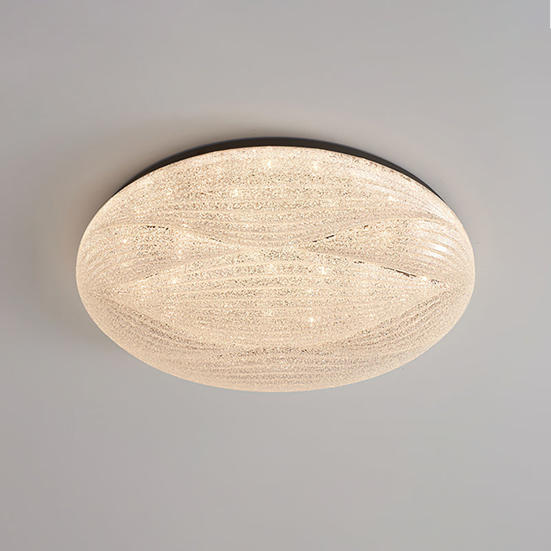 Black-rimmed Clérachic ceiling light with a clear, crystal-textured shade, seen from below on a grey ceiling.