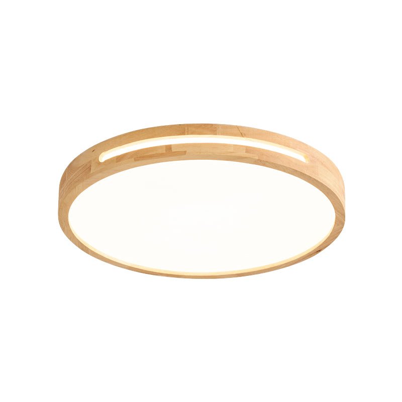 Round Clérachic ceiling light in a pale wood finish, with a slot cut into the frame and a frosted panel below, on white.