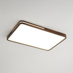 Rectangular walnut-frame Clérachic ceiling light lit cool white, with a slim slot along the rim, on a grey ceiling.