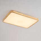 Light wood rectangular ceiling light from Clérachic, softly lit, with a slot along the frame and a frosted panel, on grey.