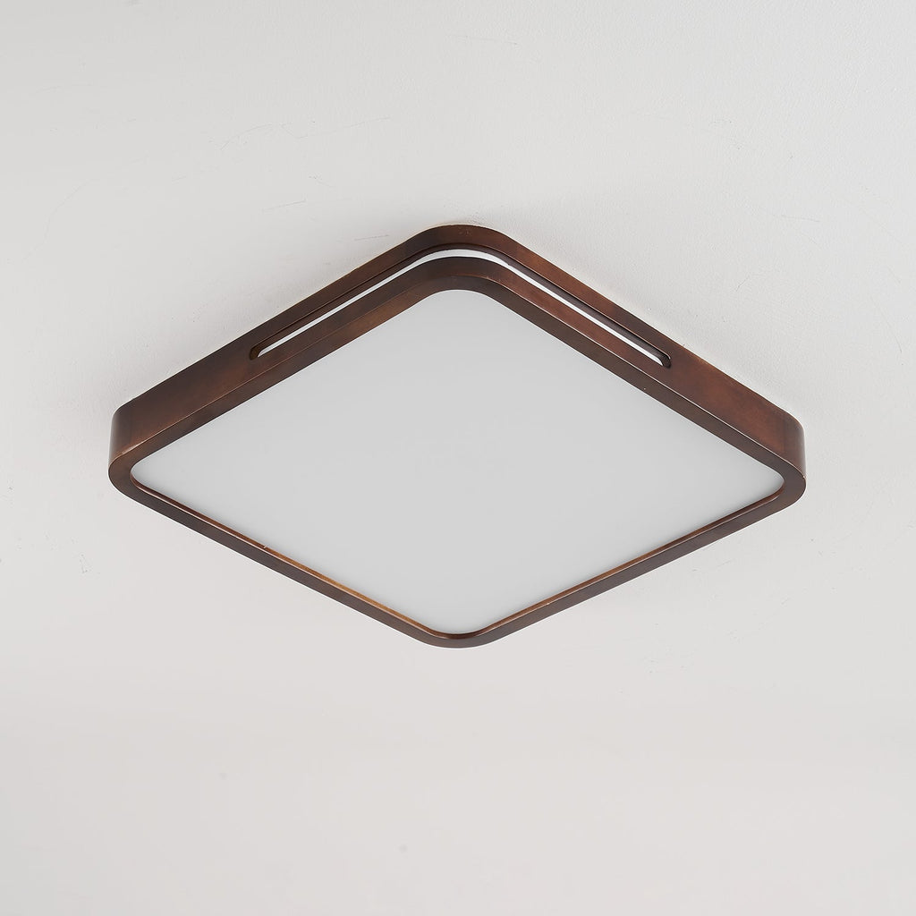Square walnut ceiling light from Clérachic with rounded corners, switched off so the frosted panel looks plain white.