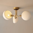 One shade of this Clérachic ceiling light turned to show the bare bulb inside, with the other two shades closed.