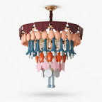 A Clérachic tiered chandelier of glazed ceramic pieces in peach, teal, orange and pink under a burgundy top, shown on white.