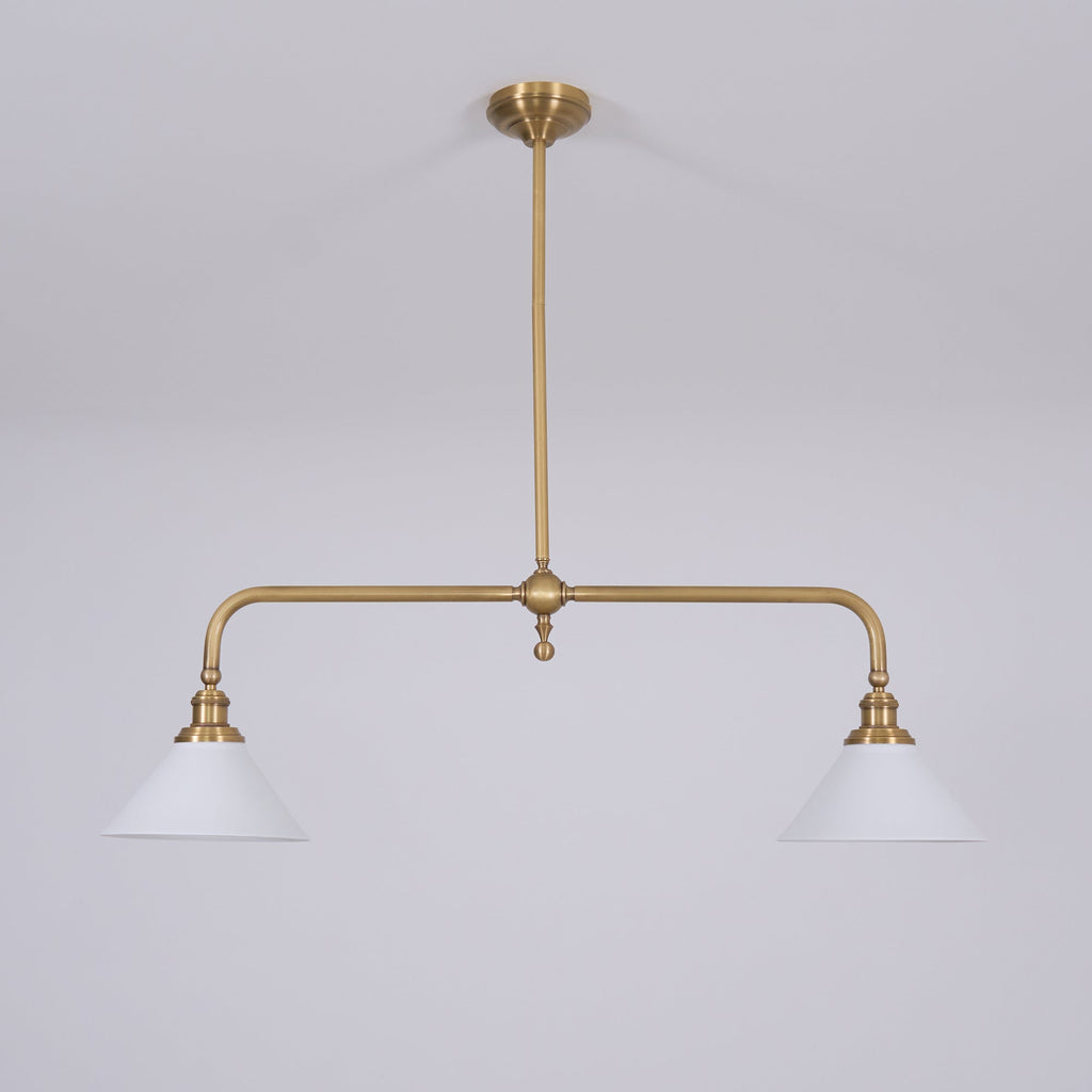 Clérachic pendant light on a plain grey backdrop, both white cones level and the turned finial hanging at the centre of the crossbar.