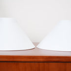 Clérachic pendant light’s two shade options seen edge-on on the console, their cone profiles matching from rim to apex.