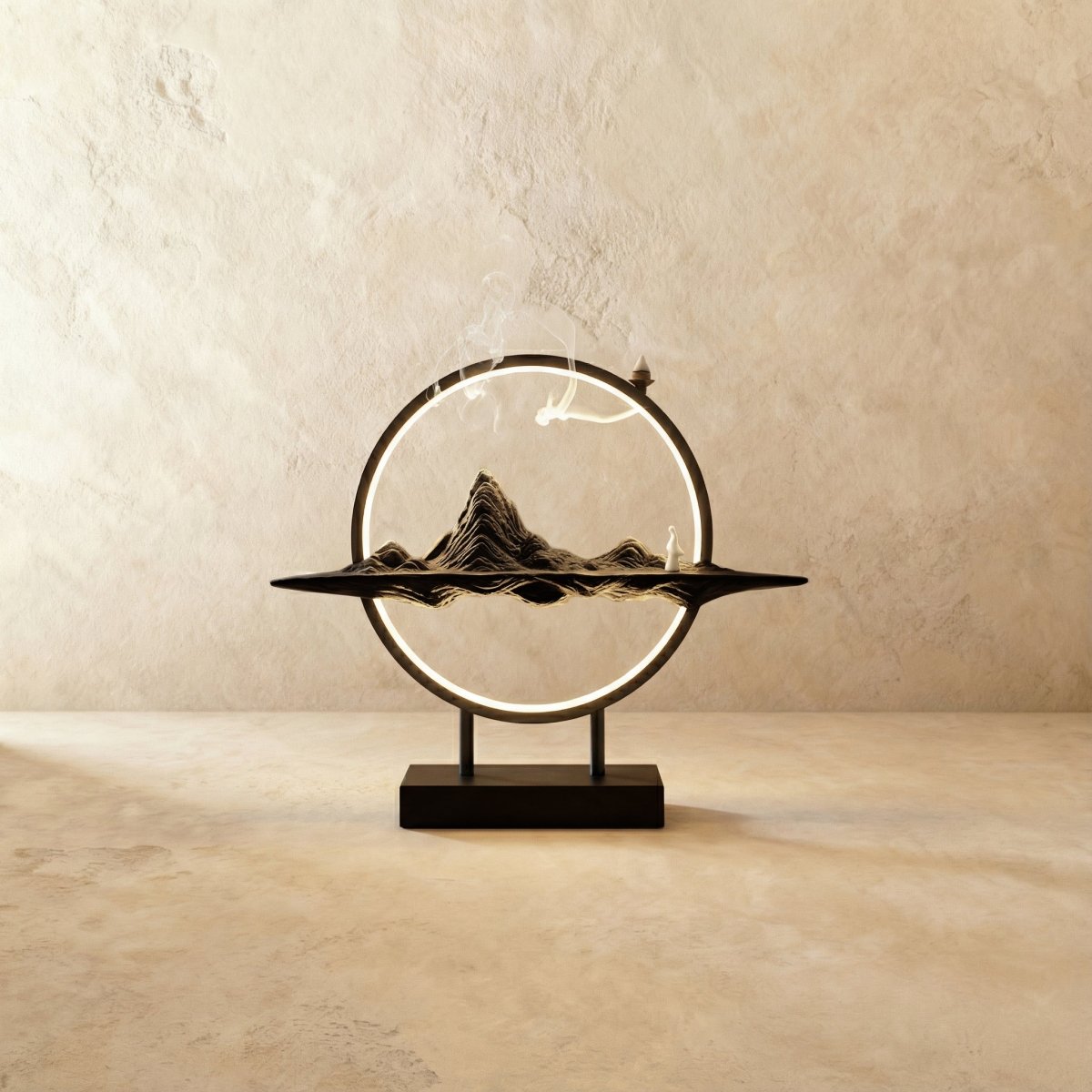 Clérachic Mountain-finish incense burner lamp, a dark ridged peak on a slim tray with incense smoke rising through its ring.