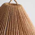 Detail of the twisted paper-rope strands on the shade of this Clérachic table lamp, with its braided loop at the top.