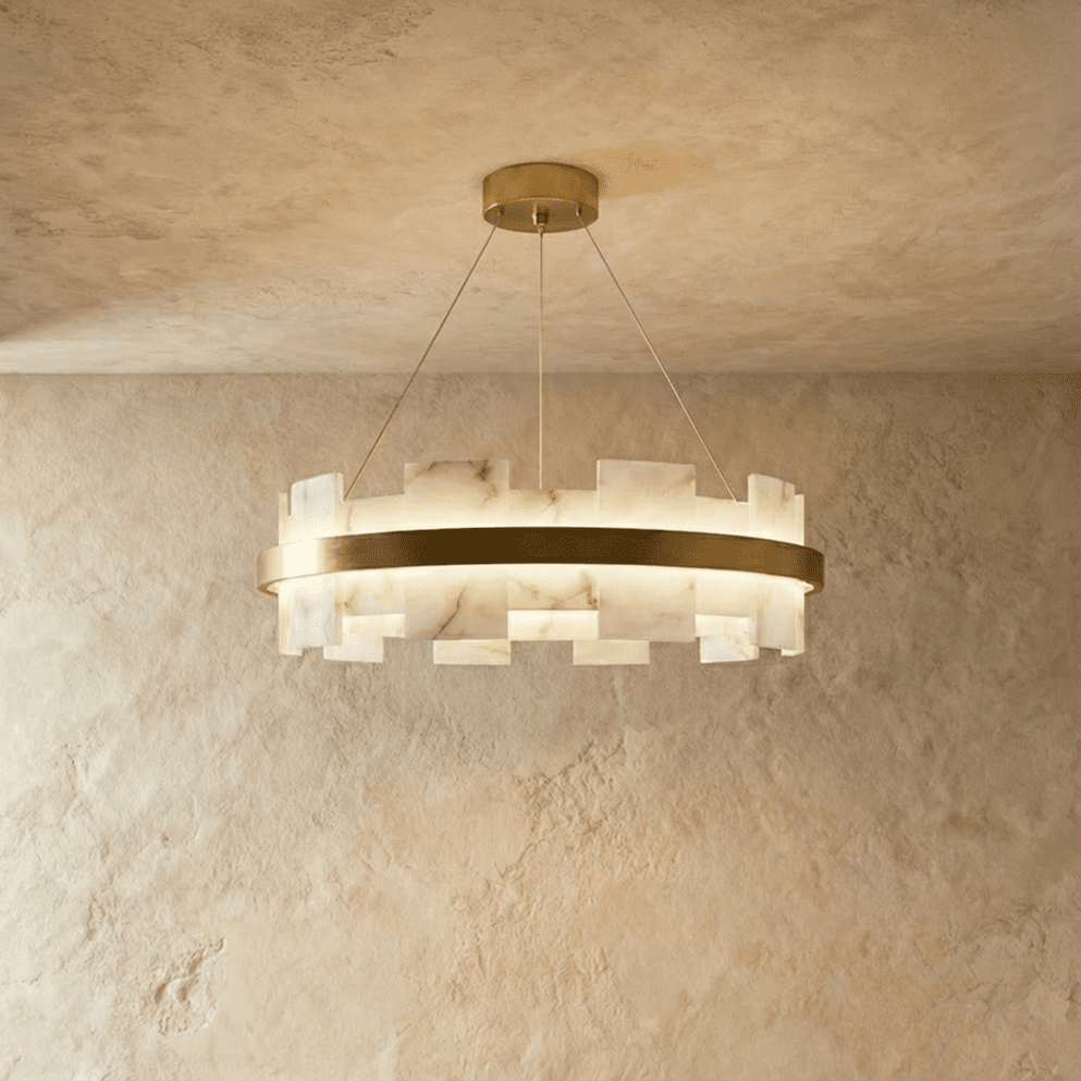 Clérachic circular chandelier with staggered alabaster panels around a brushed brass ring, lit on three fine cables.