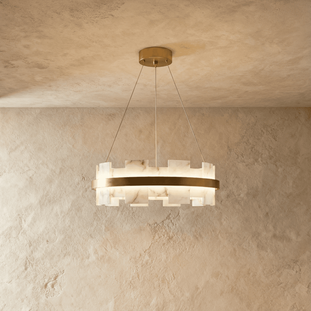 Clérachic smaller circular chandelier, staggered veined alabaster segments around a brushed brass ring, lit.