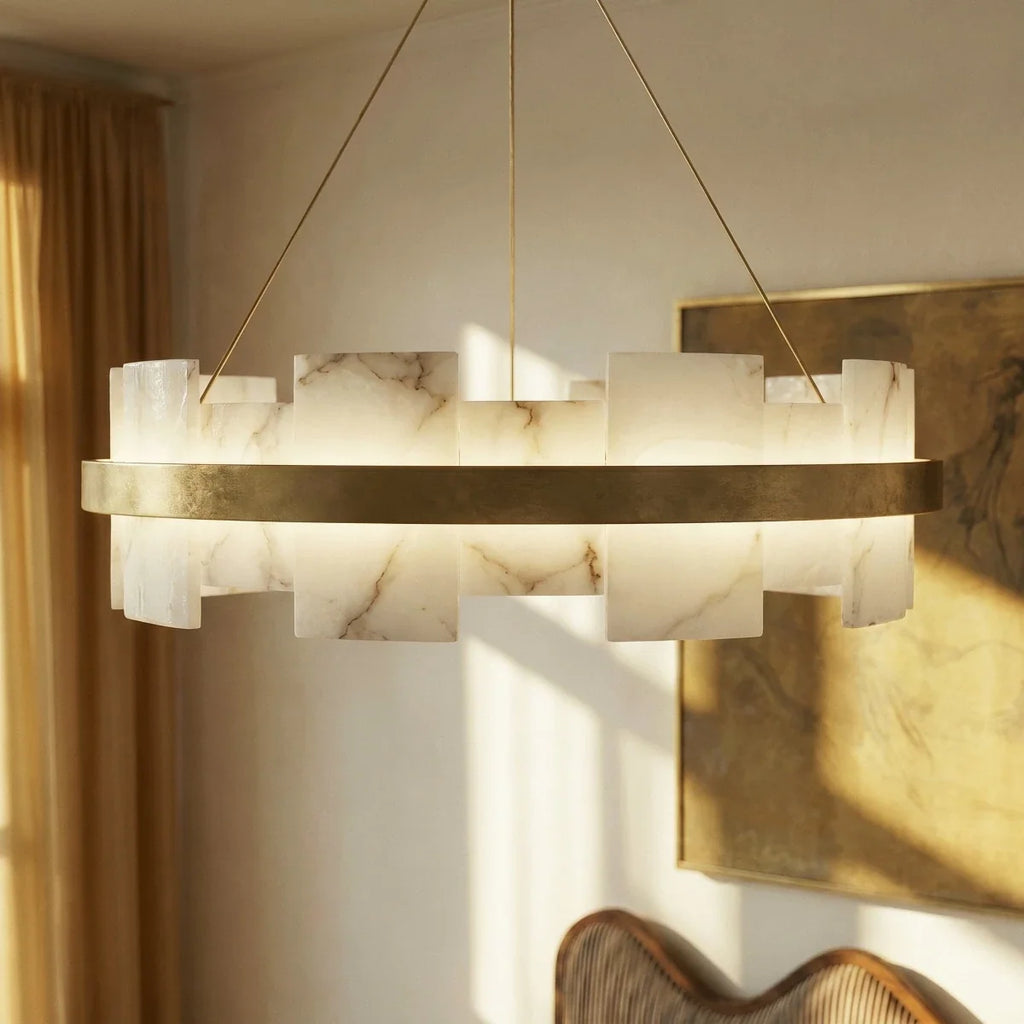 Clérachic chandelier in close view, veined alabaster panels glowing warm above a brass band on fine cables.
