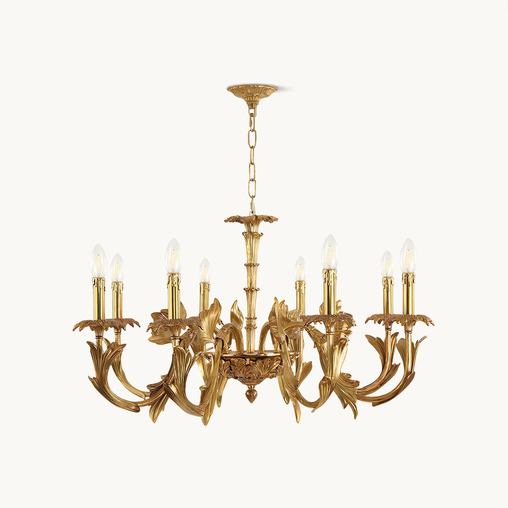 Antique brass candle-style chandelier from Clérachic on a plain white backdrop, with curved leaf-shaped arms and a hanging chain.