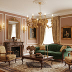 A Clérachic brass chandelier hangs over a coffee table in a rose-panelled sitting room with a green sofa and a stone fireplace.