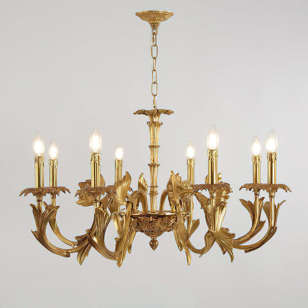 Straight-on view of the Clérachic antique brass chandelier on grey, candle-style bulbs lit above sweeping leaf arms.