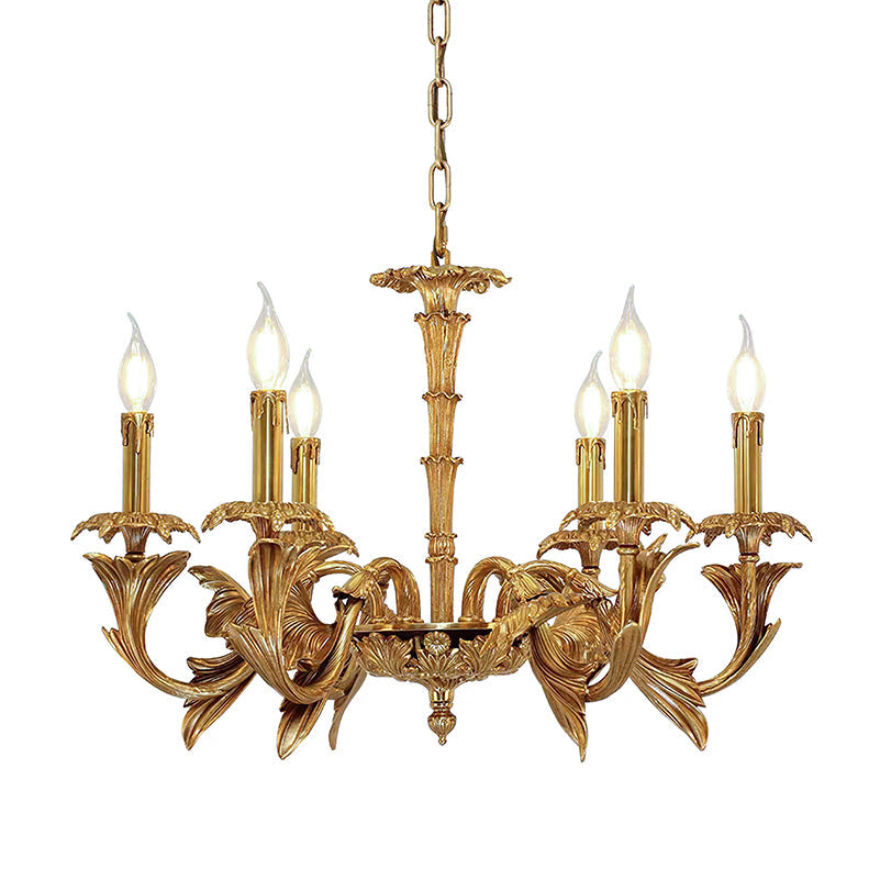 Smaller Clérachic brass chandelier on white, with flame-tip bulbs on curved leaf-shaped arms.