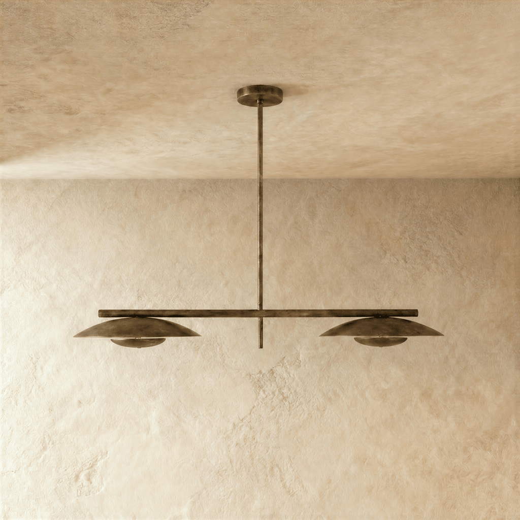 Clérachic chandelier in vintage brass, front view of the paired disc shades on their ceiling rod.