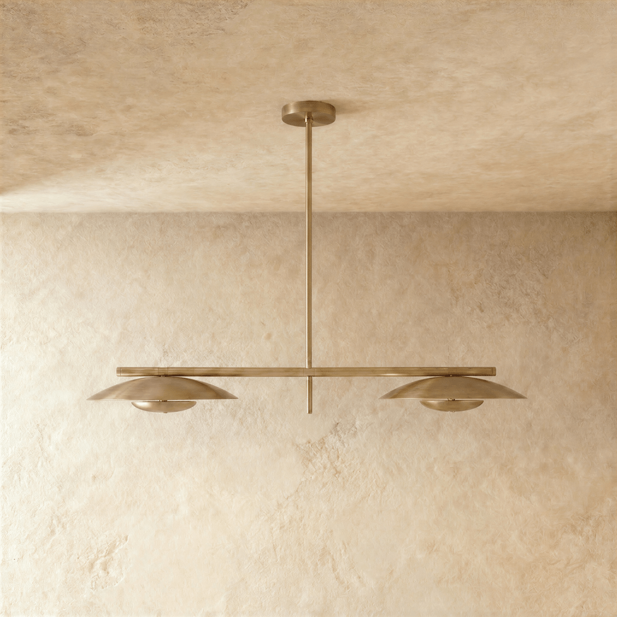Clérachic chandelier in satin brass, close front-on view of the two disc shades and center rod.