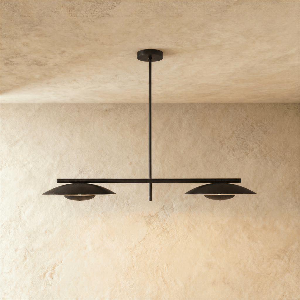 Clérachic chandelier in matte black, two angled disc shades suspended from a slim horizontal bar.