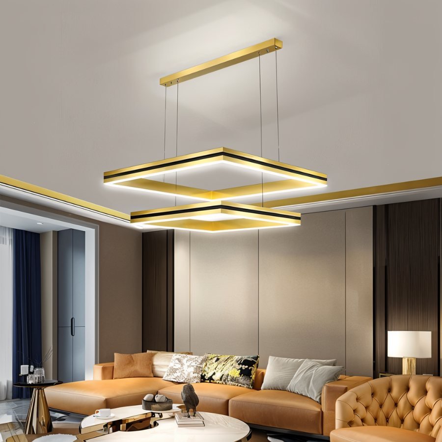 Clérachic gold two-tier square LED chandelier with black inner bands, hanging above a tan leather sofa.