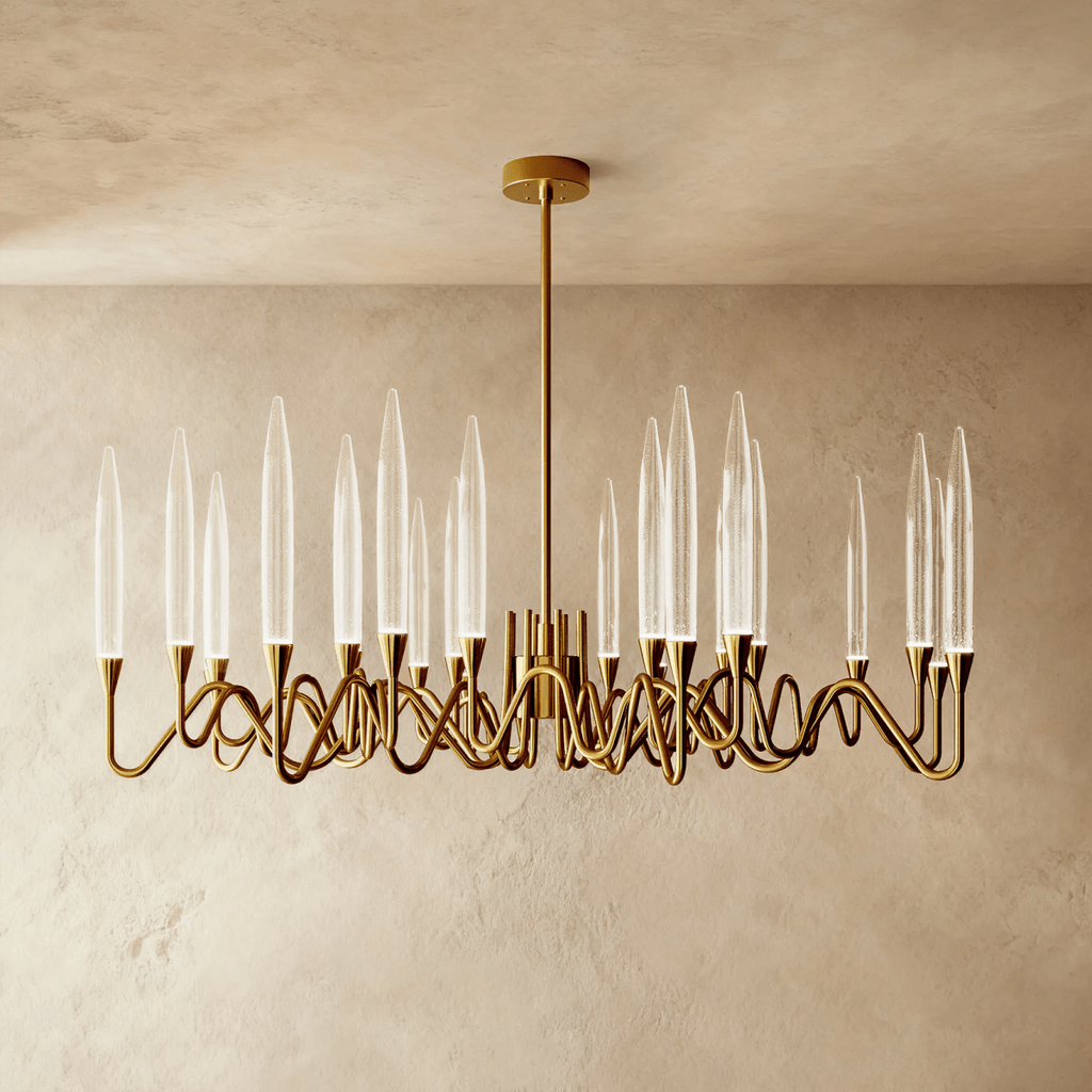 Clérachic wide round brass chandelier with tall clear glass shades on sweeping wavy arms, on a single rod and round canopy.