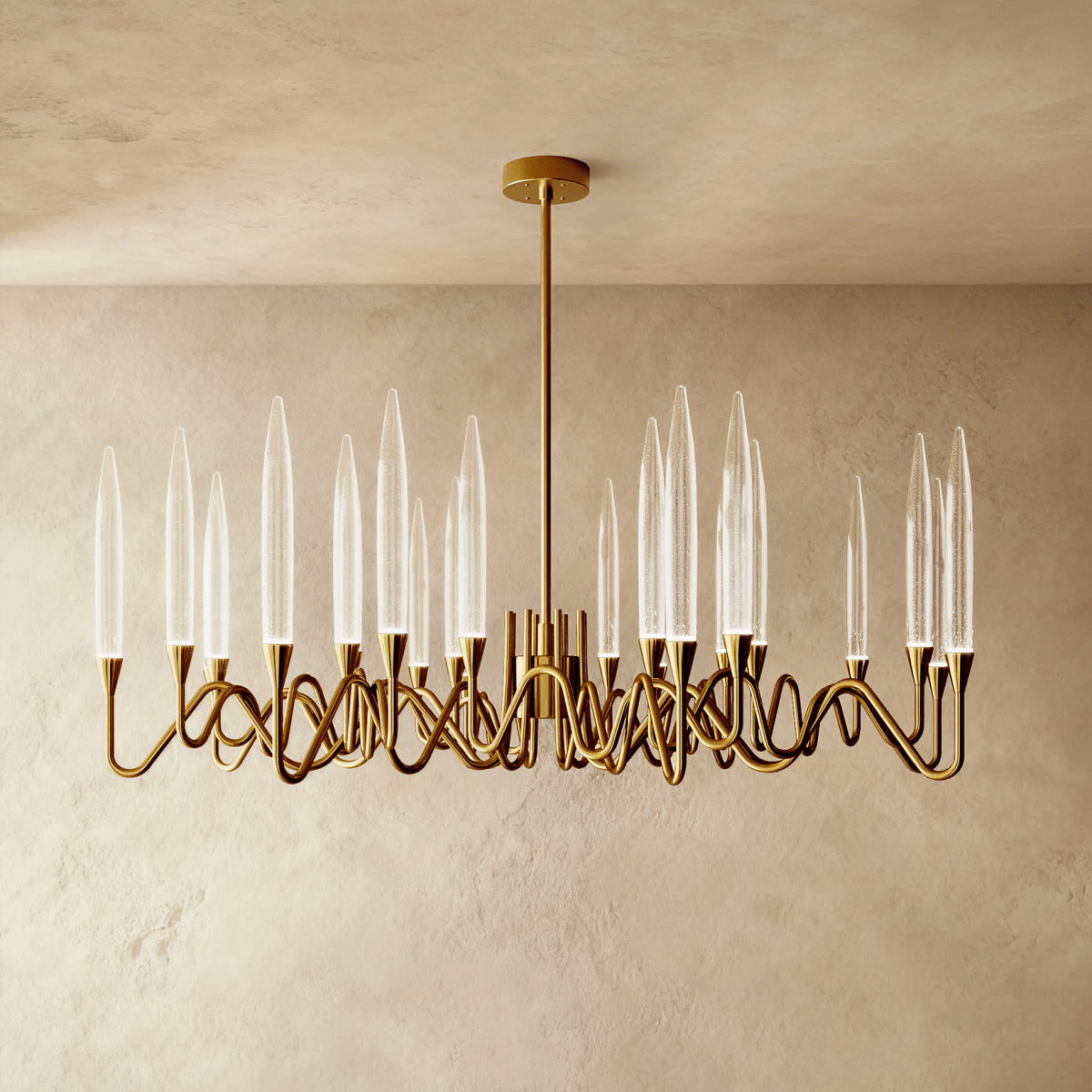 Clérachic wide round brass chandelier with tall clear glass shades on sweeping wavy arms, on a single rod and round canopy.