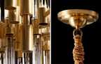 Two details of this Clérachic chandelier, the brass sockets under the frame and the ceiling plate with its gold-brown cloth chain cover.