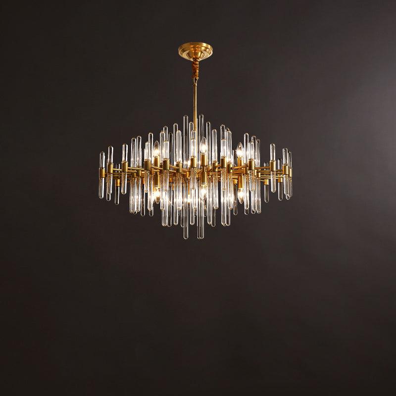 This Clérachic chandelier hangs from a ceiling plate and rod against a brown backdrop, its glass rods in two staggered tiers.