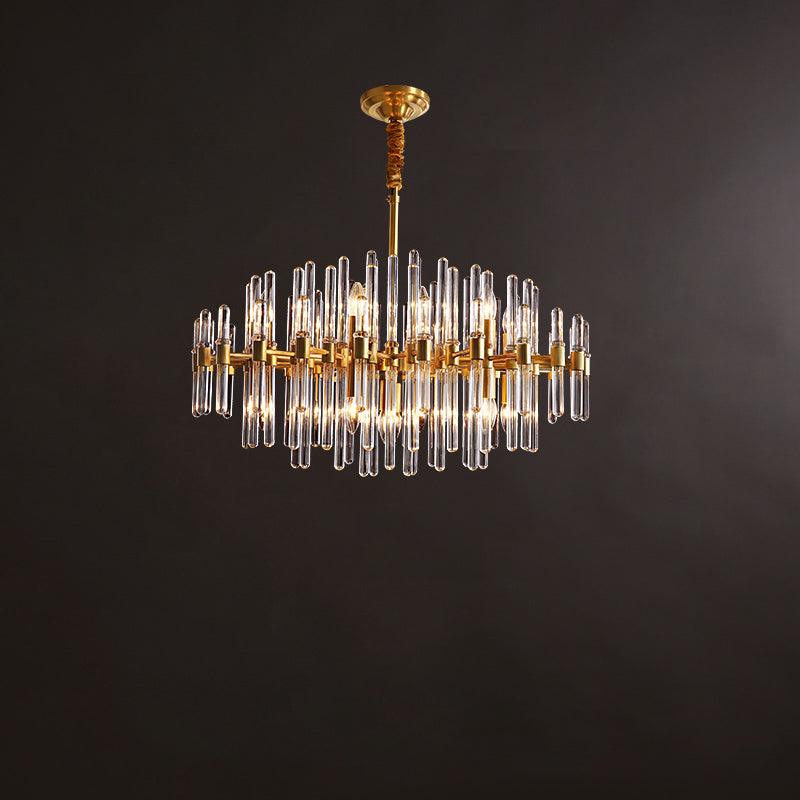 Wide, low Clérachic brass chandelier with a single row of long glass rods, hanging from a short rod against a brown backdrop.