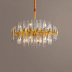 Wide view of this Clérachic chandelier on a muted brown-grey backdrop, its glass rods spread in a lit, round form.