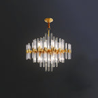 A Clérachic chandelier on a short rod against a dark wall, its brass frame holding clear glass rods of varied lengths.