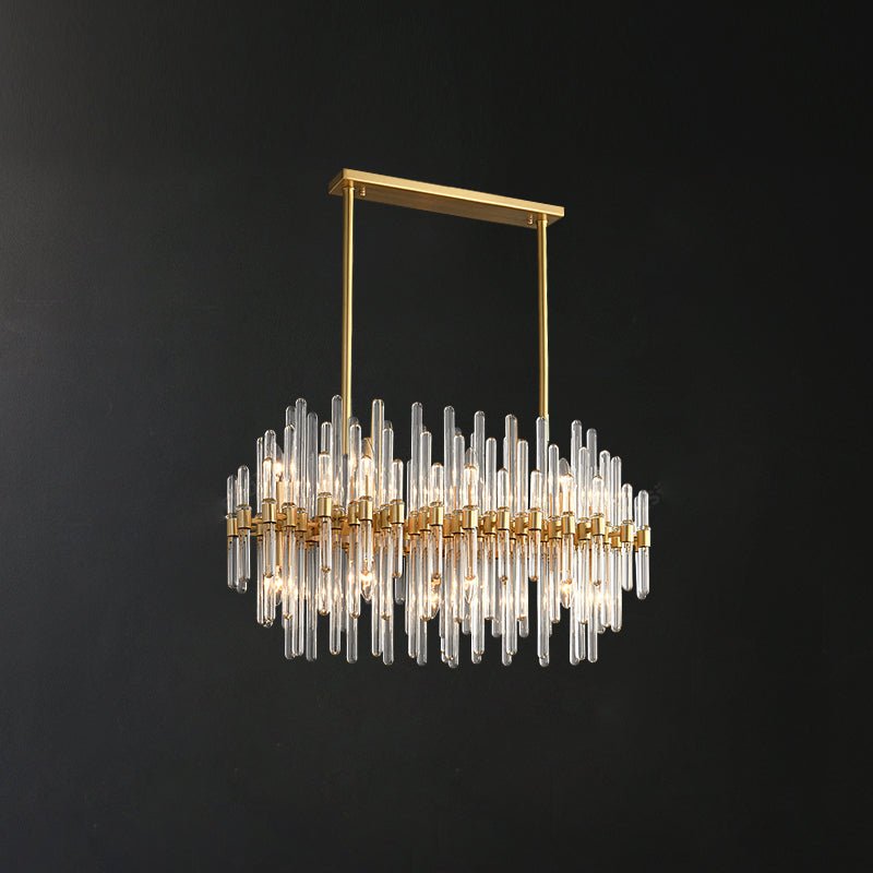 A linear Clérachic chandelier hung from a brass bar by two rods, with rows of clear glass rods, against a dark backdrop.