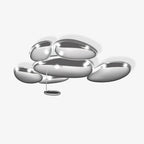 Clérachic 6-head Chrome Ceiling Light on a pale studio ceiling, a small oval LED hanging from a slim rod.