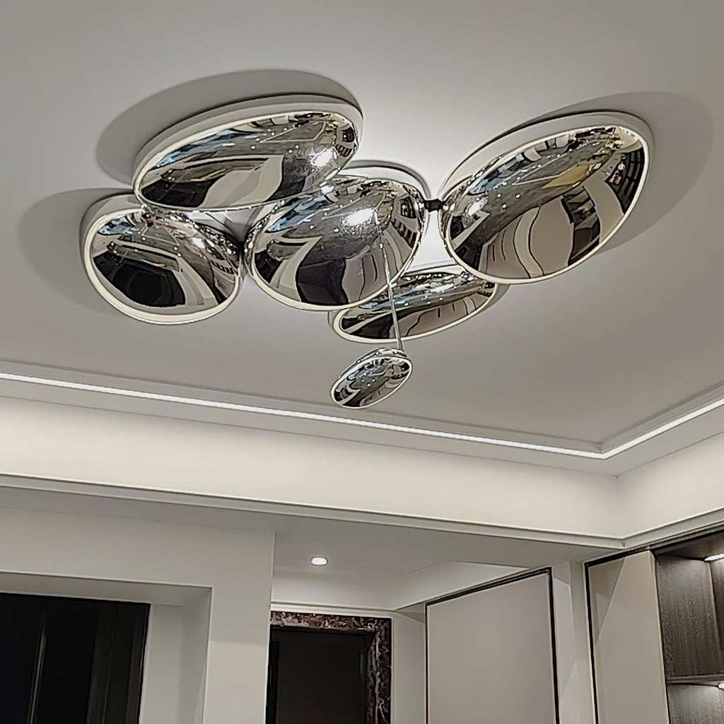 Clérachic 6-head Chrome Ceiling Light beside a recessed LED cove and dark wood cabinetry with shelf lighting.