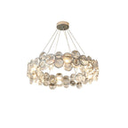 Round Clérachic chandelier with clear crystal discs, seen from slightly below on white.