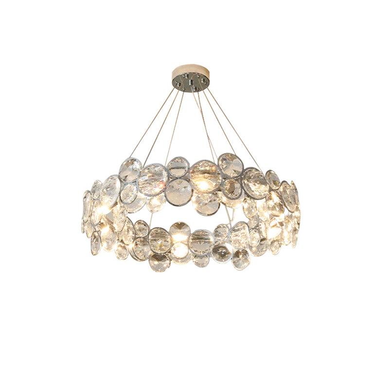 Round Clérachic chandelier with clear crystal discs, seen from slightly below on white.