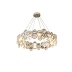 Front view of this round Clérachic crystal chandelier on white, with five cables rising to a small canopy.
