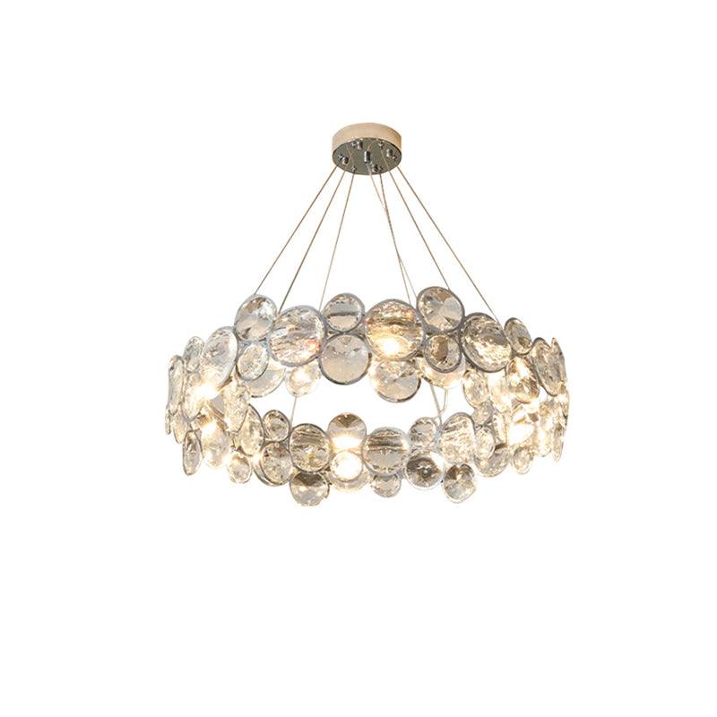 Front view of this round Clérachic crystal chandelier on white, with five cables rising to a small canopy.