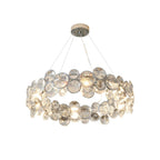 Larger round Clérachic crystal chandelier with two rings of discs, cut out on a white background.
