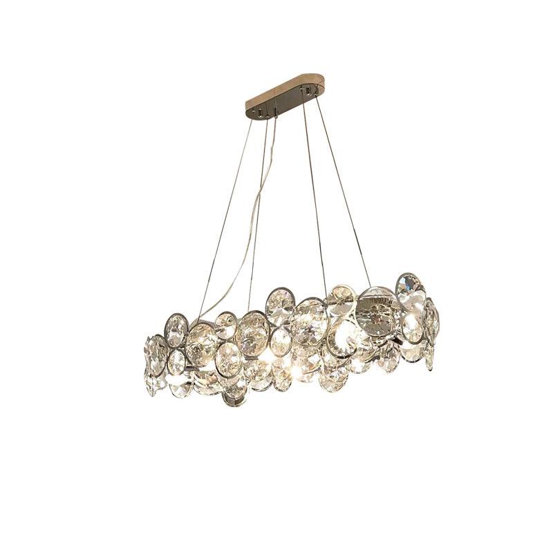 Oval Clérachic crystal chandelier with a long chrome canopy and four cables, on a white background.