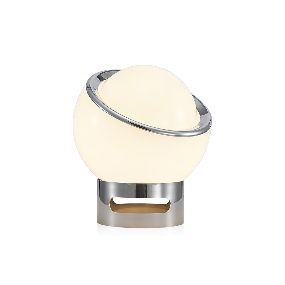 Lit white Clérachic table lamp with a tilted chrome ring and a chrome base with an oval cut-out, on a plain white backdrop.