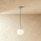 Clérachic Cells pendant light in Straight, Chrome, a polished nickel rod suspending a frosted glass globe shade.