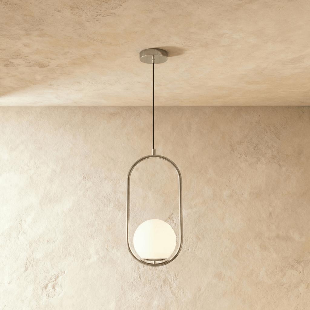 Clérachic Cells pendant light in Oval, Chrome, a polished nickel oval frame cradling a frosted glass globe shade.