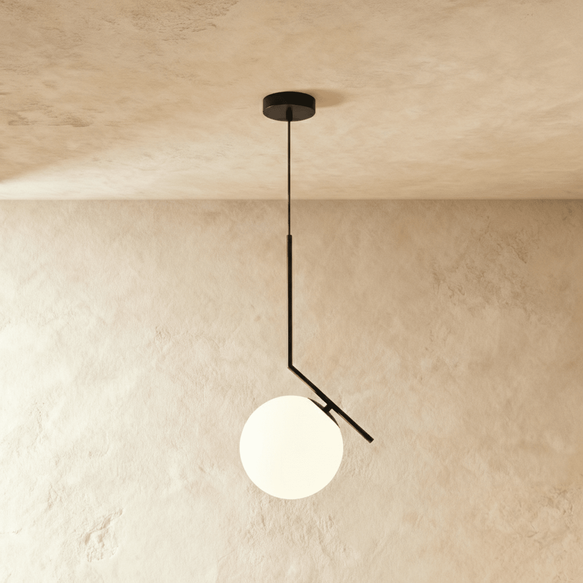 Clérachic Cells pendant light in the Canted profile, Black, an angled matte black rod holding a frosted glass globe.