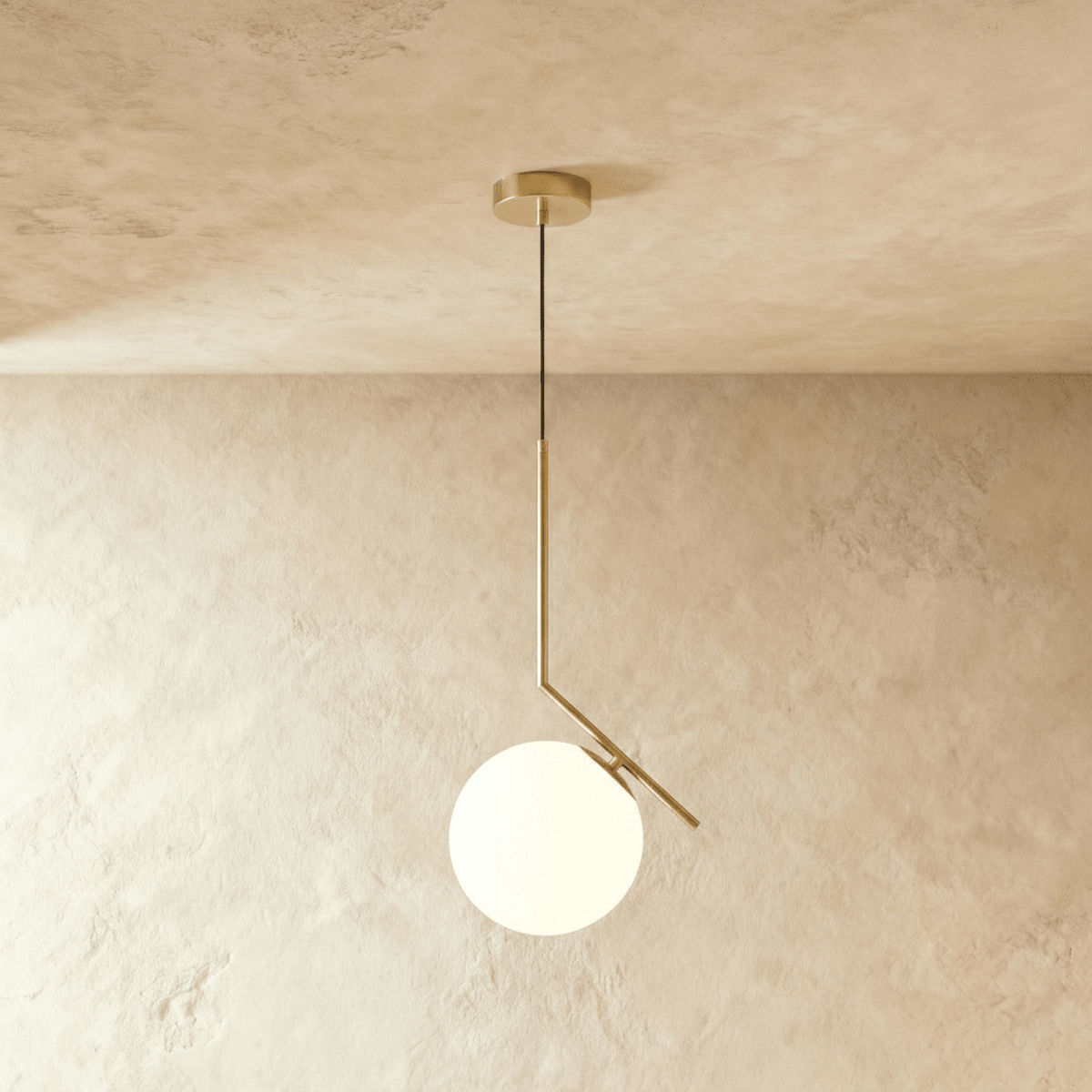 Clérachic Cells pendant light in the Canted profile, Brass, an angled brass rod holding a frosted glass globe.
