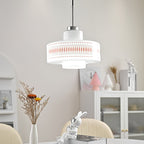 A Clérachic pendant with a printed opal glass shade hangs above a table with dried flowers, a glass cabinet and a rabbit figure.