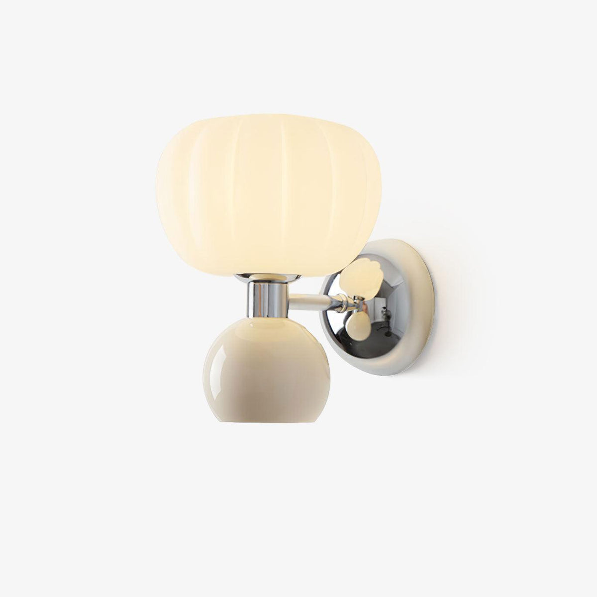 Chrome wall light from Clérachic with a ribbed cream glass shade above a rounded cream metal ball, lit on a plain white backdrop.