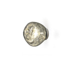 A Clérachic wall light with a clear smoky shade, with swirls in the glass, lit on a white background.