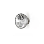 A Clérachic wall light with a chrome-silver shade and a reflective inside, on a white background.