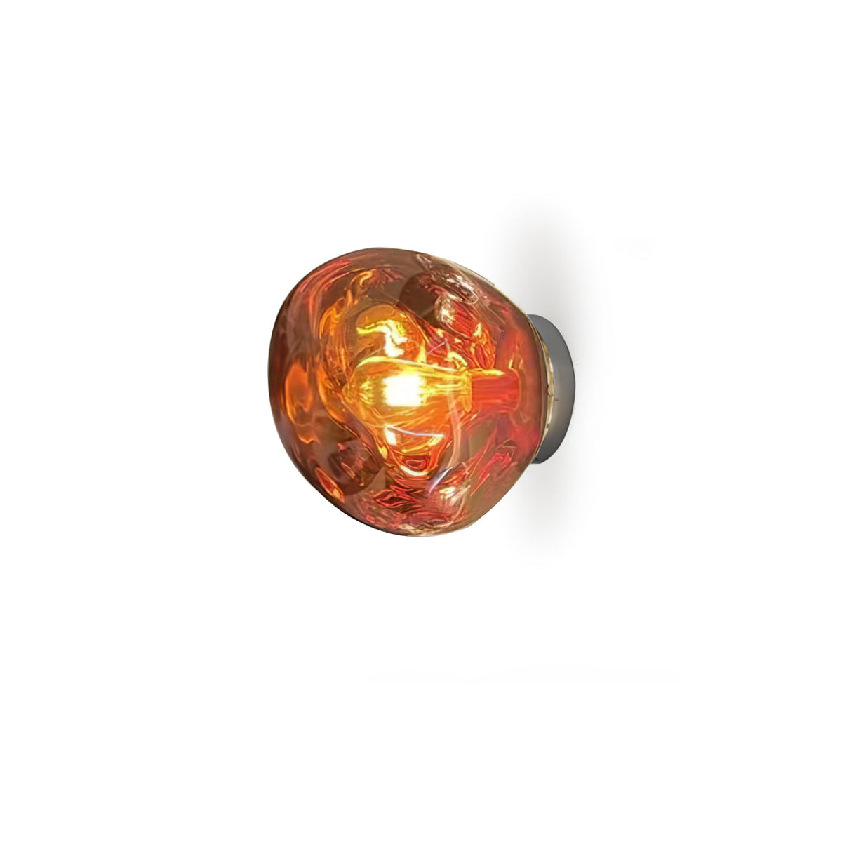 A copper-toned Clérachic wall light, lit, with a visible filament bulb inside the melted-glass shade, on white.