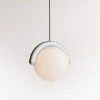 Clérachic Citheis single pendant on white, opal glass globe cradled by a curved metal hook.